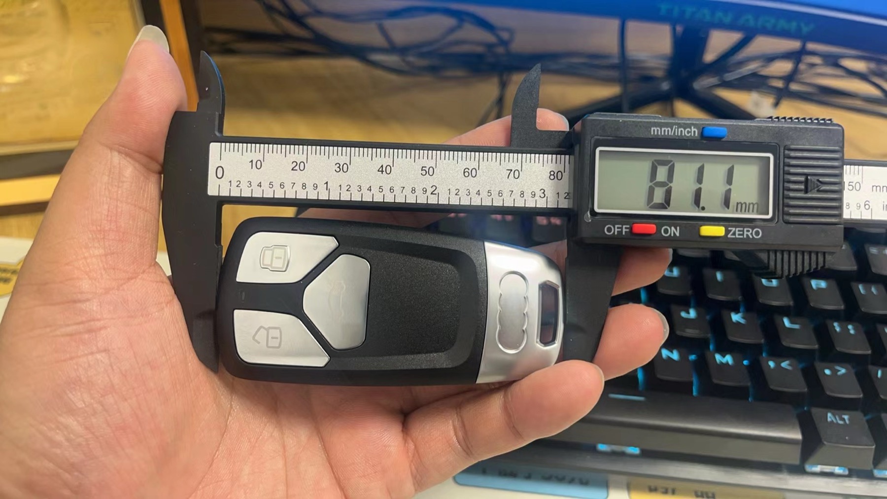 Measuring a key fob with a digital caliper for compatibility fit review
