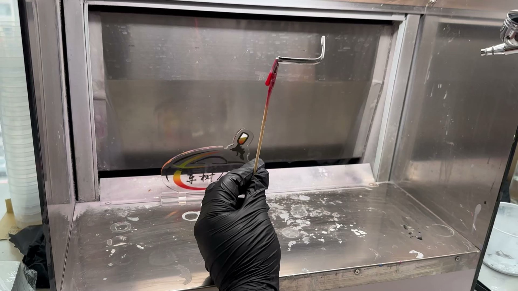 Airbrush painting process for a custom key fob shell part